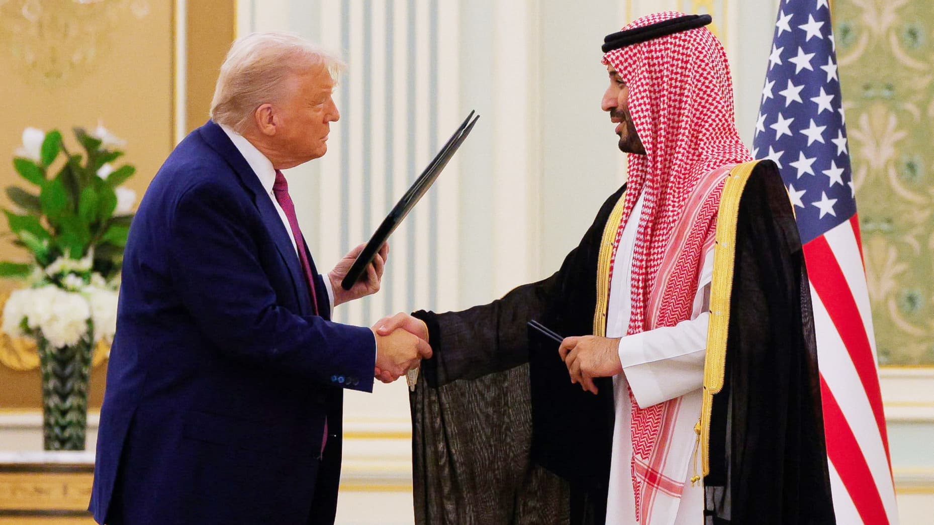 U.S. President Donald Trump and Saudi Crown Prince and Prime Minister Mohammed Bin Salman shake hands during a Memorandum of Understanding (MOU) signing ceremony at the Royal Court in Riyadh, Saudi Arabia, May 13, 2025. REUTERS/Brian Snyder